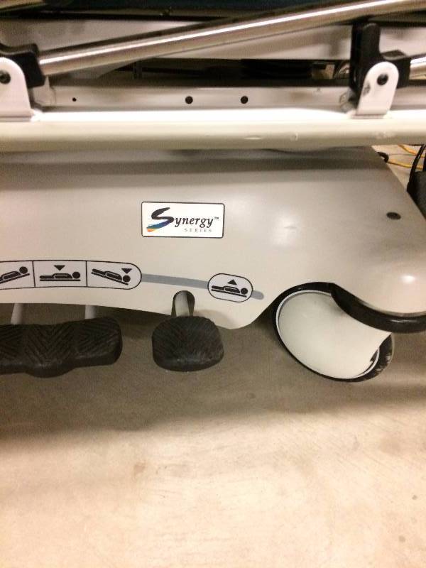 lot 74 image: WOW Retails used $3000  Stryker Transport Electric Stretcher Synergy Series Gurney Hospital Medical Clinic Tilt Hi & Low Sit Up Knees UP DOWN With Free Mattress - Excellent Condition