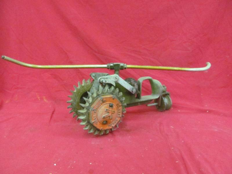 lot 11 image: vintage cast iron lawn sprinkler