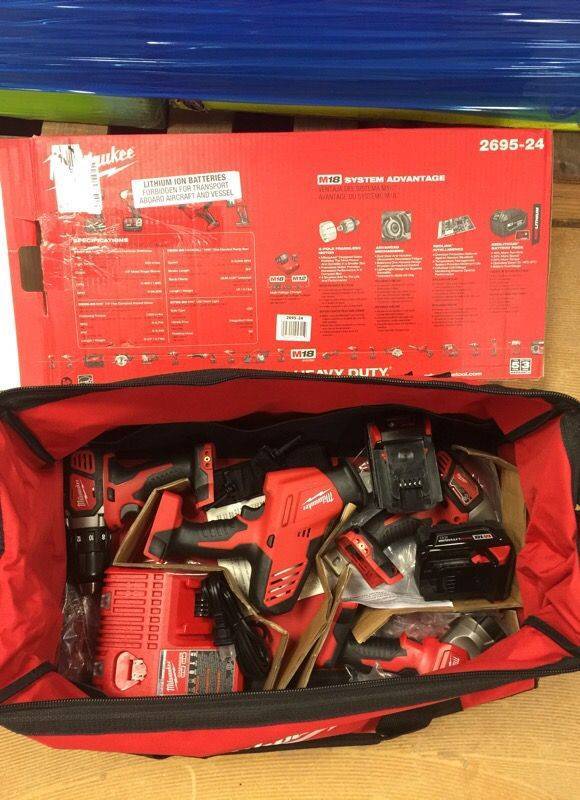 lot 00 image: Milwaukee M18 18-Volt Lithium-Ion Cordless Hammer DrillHACKZALLImpact DriverLight Combo Kit (4-Tool)  Model # 2695-24 OPEN BOX NEVER USED