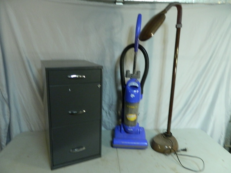lot 169 image: Bagless Vacuum, Metal File Cabinet, and Floor Lamp
