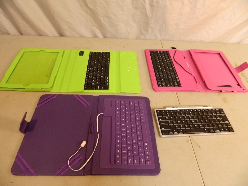 lot 81 image: 3 Tablet CasesKeyboards and Wireless IHome Keyboard