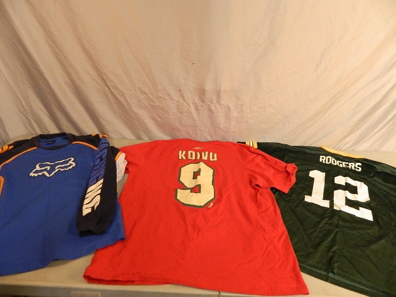 lot 95 image: Minnesota Wild Shirt, Green Bay Jersey, and More