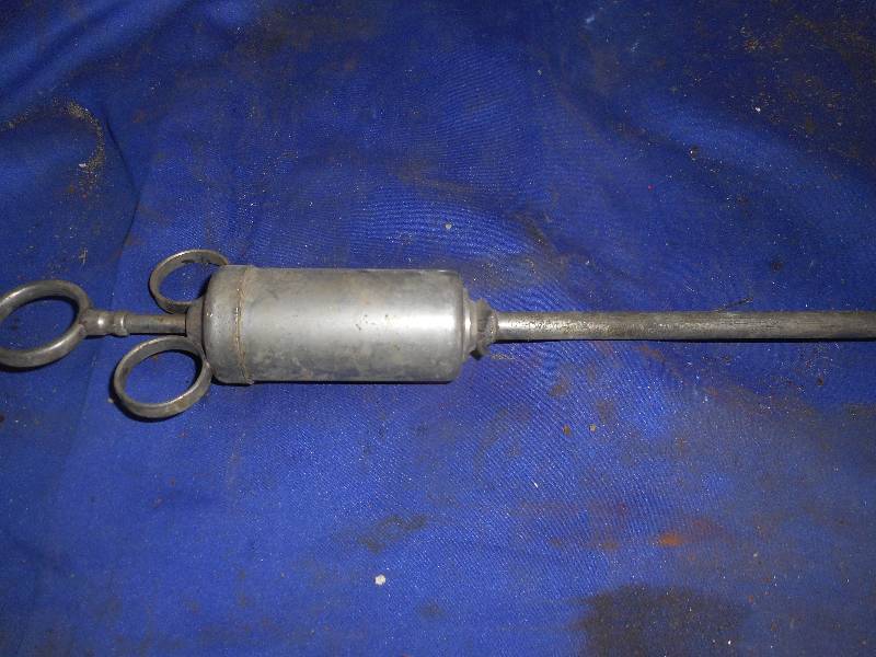 lot 23 image: ANTIQUE STAINLESS SURINGE