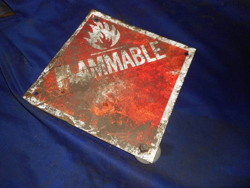 lot 35 image: STEEL FLAMIBLE SIGN