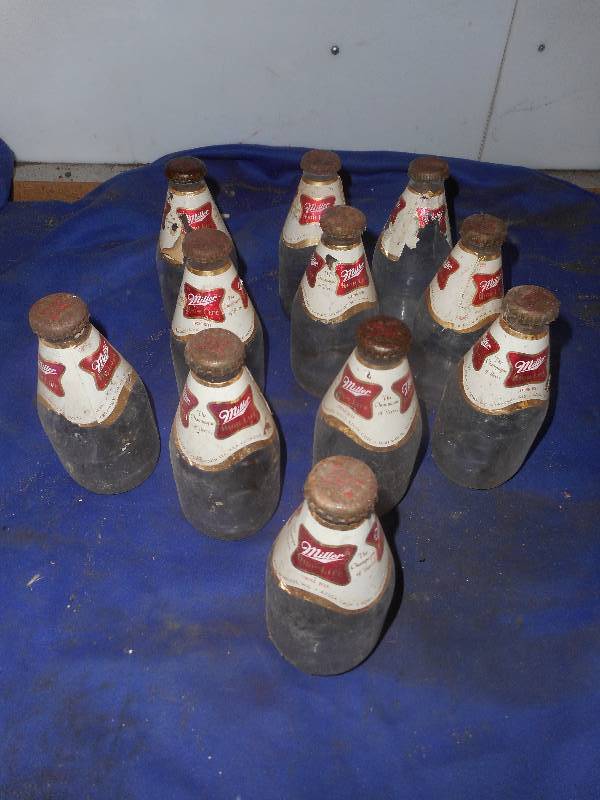 lot 78 image: VINTAGE MILLER BOTTLES