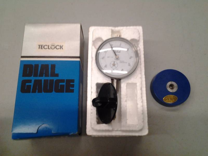 lot 38 image: Teclock Calibration Dial Indicator Model A1-921 .001 Inch Thru 1.0 Inch With Uni-Magnet Mount