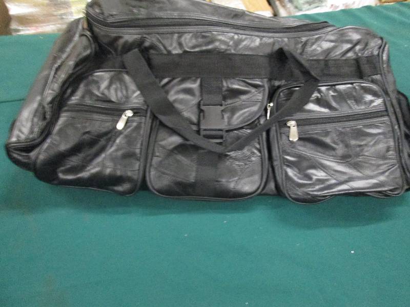 lot 110 image: Black Rolling Multi-pocket Duffel o...