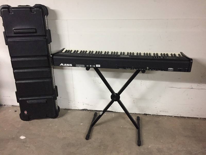 lot 1 image: Alesis QS8 Full-Size KeyboardSynthesizer with Hard-Sided Travel Case & Stand