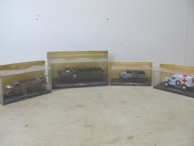 lot 122 image: 4 NIB WW2Military Diecast Vehicles