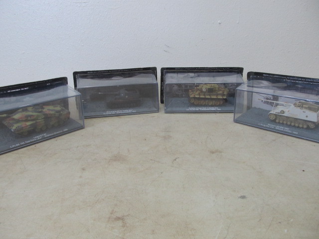 lot 125 image: 4 NIB WW2Military Diecast Vehicles
