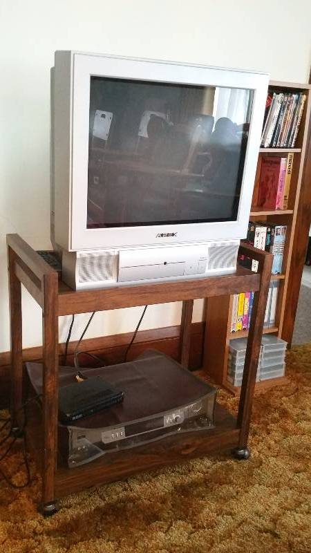 lot 20 image: Apex TV, Sony VHS Player, VHS Tapes, TV & VHS Stand