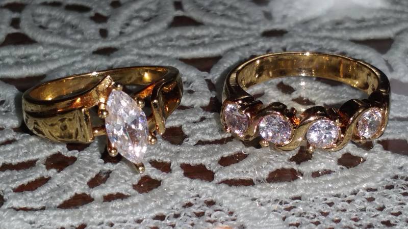 lot 151F image: (2) Costume Jewelry Gold Rings