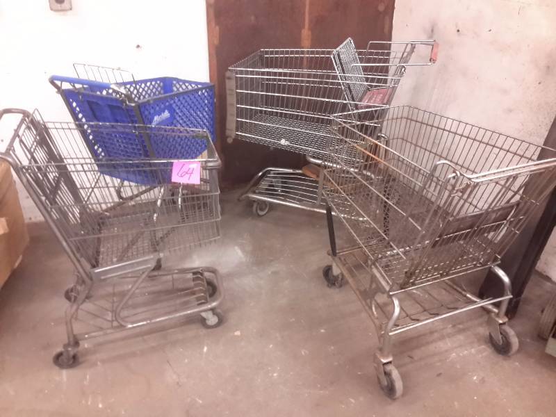 lot 64 image: 4 shopping carts and lawn spreader