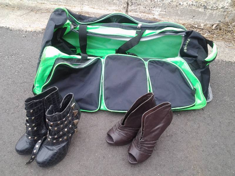 lot 12 image: 2-Pair High Heel Boots Size 8&9 In Rolling Duffel Bag