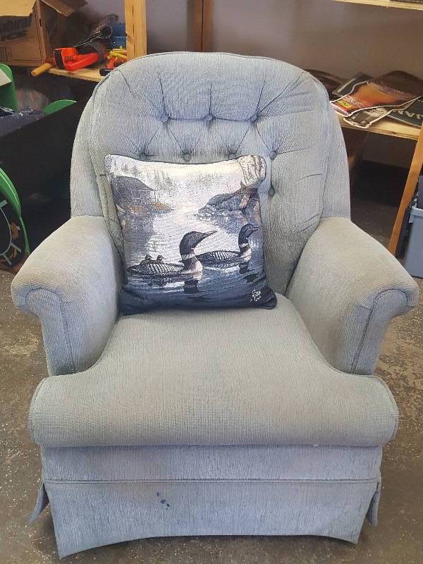 lot 71 image: Blue Swivel Rocker With Decorative Loon Pillow