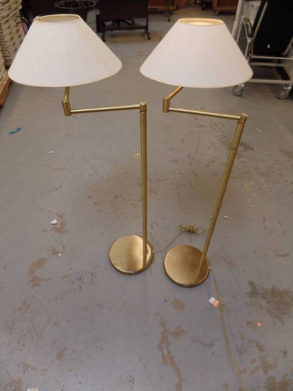 A PAIR OF SWING ARM FLOOR LAMPS