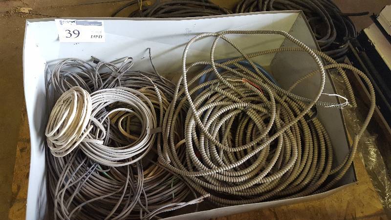 lot 39 image: Large quantity of Romex electrical wire  - Also includes 2-strand greenfield wire for warehousegarage style applications.
