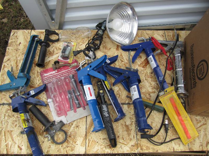 Lot of caulk guns, lights and other...