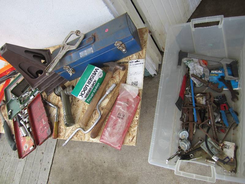 Plastic tote filled with tools, roa...