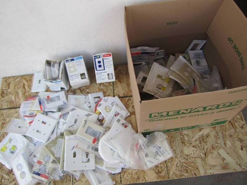 Box filled with electrical wall pla...