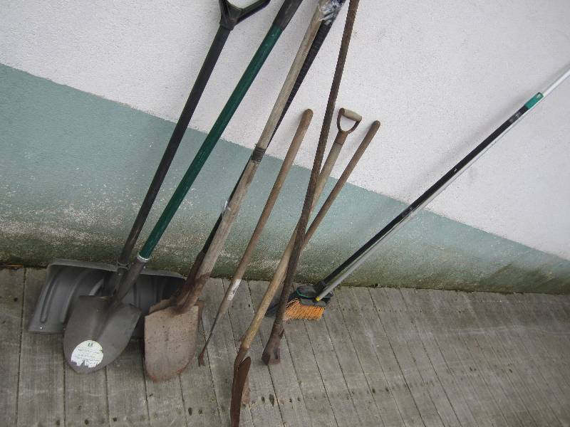 Lot of shovels and garden tools and...