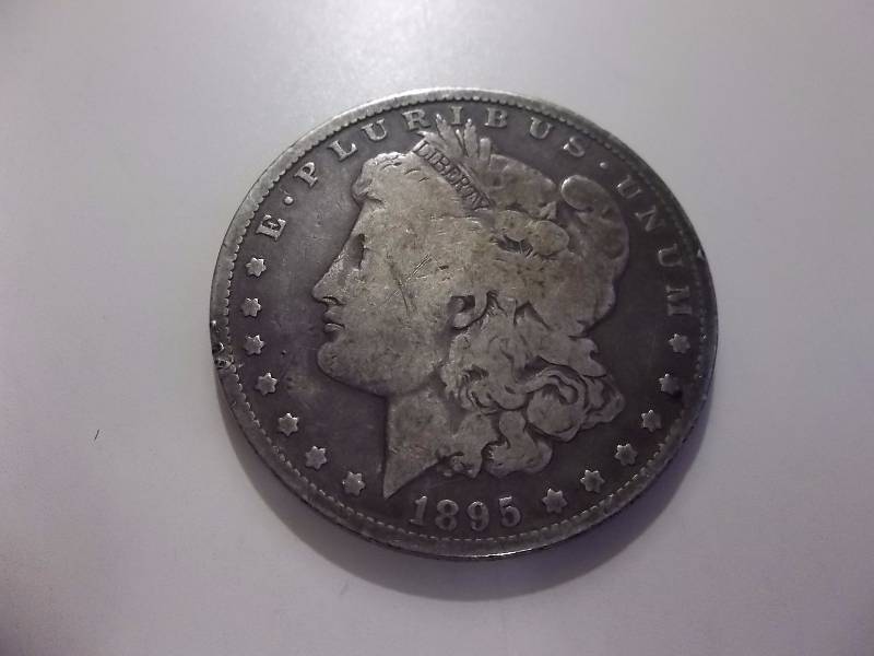 1895 O Morgan Silver Dollar Tough Date (In F-VF $280-$365)