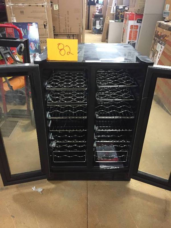 lot 82 image: Magic Chef Dual Zone 23.4 in. 42-Bottle 114 Can Wine and Beverage Cooler in like New working conditions