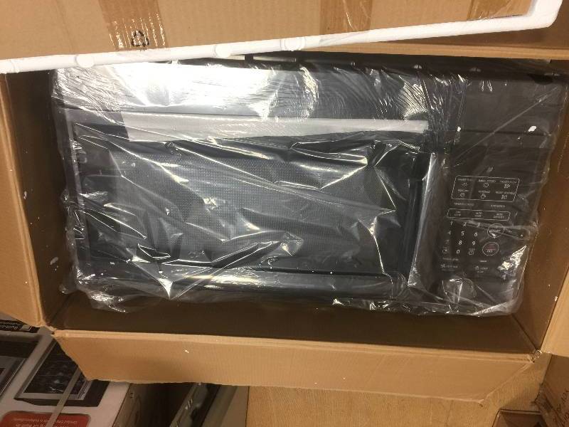 lot 44 image: Magic Chef 1.6 cu. ft. Over the Range Microwave in Black never used