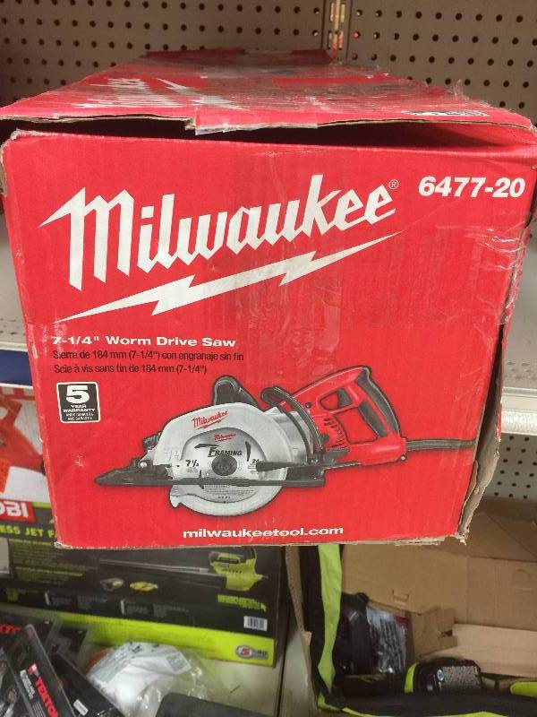 lot 70 image: Milwaukee 15 Amp 7-14 in. Worm Drive Circular Saw Model#  6477-20  open box never used