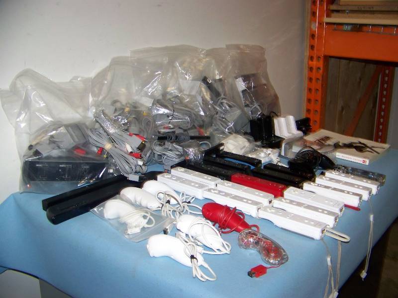 lot 107 image: LARGE lot of Nintendo Wii, Game Controllers, Power Supplies  Cables, Game Cradles, Chargers, Cooling Unit and more