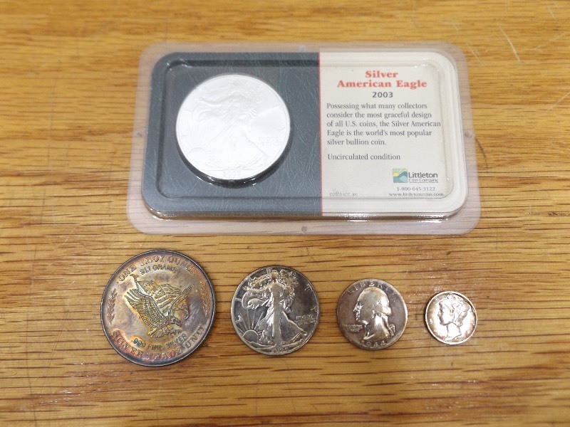 lot 26 image: 2003 Sliver American Eagle 1oz. - 99.93% Silver, US Assay Office Silver Trade Unit 1 troy oz. - .999 Fine Silver, and 1944 - 90% Silver Half Dollar, Quarter, and Dime
