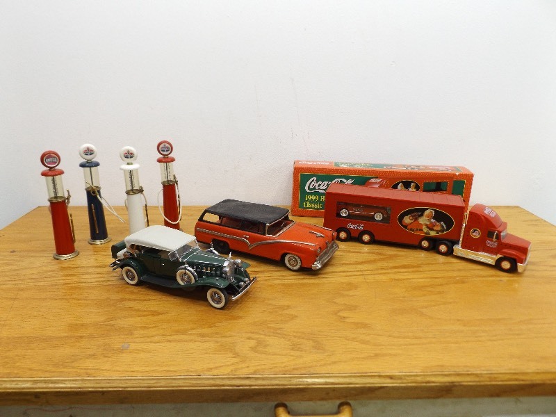 lot 48 image: Lot of Die Cast Danbury Mint, Amoco Gas Pumps, Vintage Tin Ford, and Coca-Cola Holiday Truck