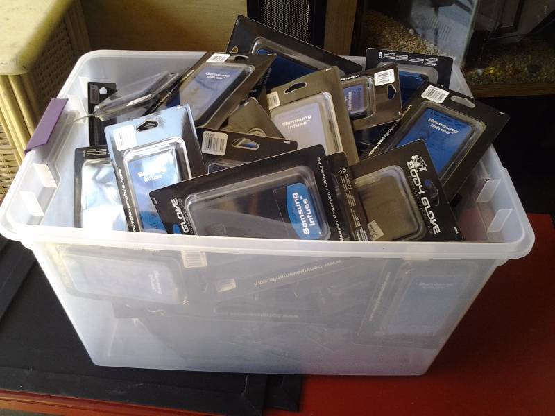 lot 30 image: Tote Full Of Samsung Infuse Body Glove Cases