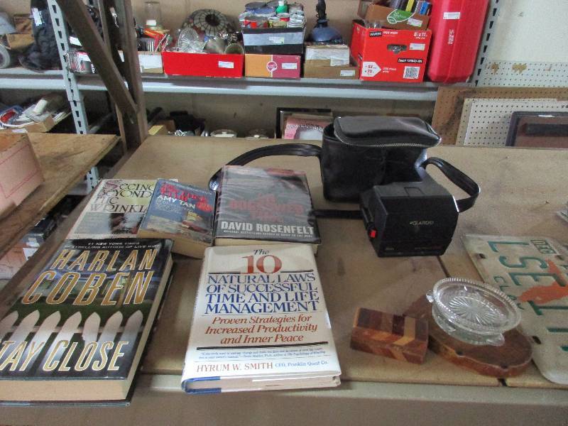 lot 13 image: license plates - books - ashtrays - camera