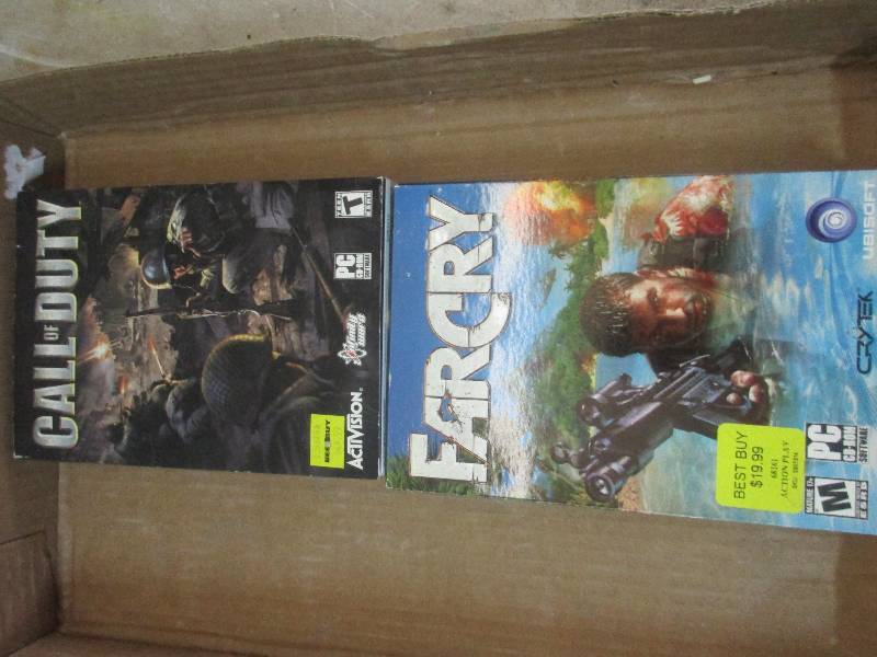 lot 74 image: PC games - Far Cry and Call of Duty and car disc man
