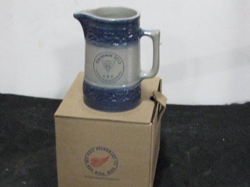 lot 46 image: Red wing Stoneware Crock Christmas 2013 St. Francis Cherry Band Pitcher