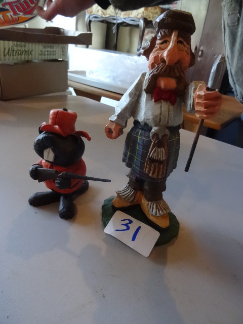 lot 31 image: David Frykman golfer statue. Gopher...