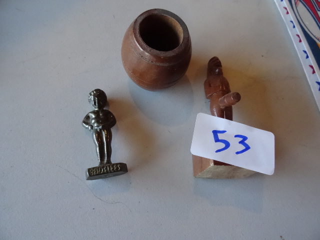 lot 53 image: Pee boy statue. Barrel pee boy stat...