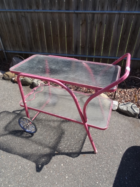 lot 86 image: 2 tier metal patio cart. Glass shel...