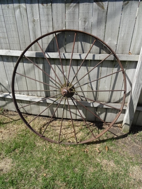 lot 92 image: Vintage 54 metal wheel lawn orname...