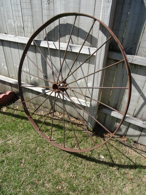lot 93 image: Vintage 54 metal wheel lawn orname...