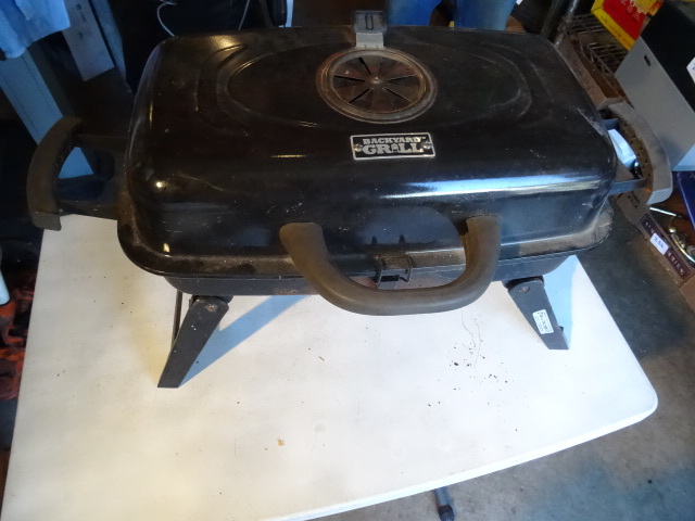 lot 140 image: Back yard barbeque grill. Charcoal...