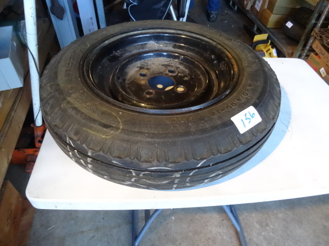 lot 156 image: Trailer tire and 4 holr rim. 4.80-4...