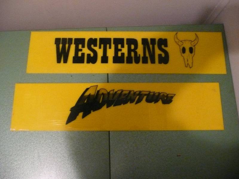 lot 25 image: Vintage Western & Adventures Signs - Plastic Approx 24wide 6high