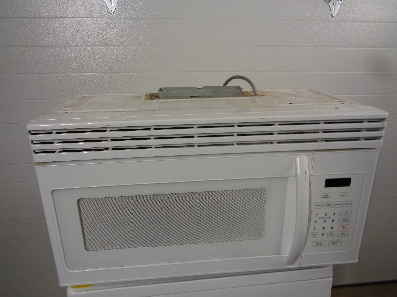 lot 131 image: Haier Above the Stove Microwave