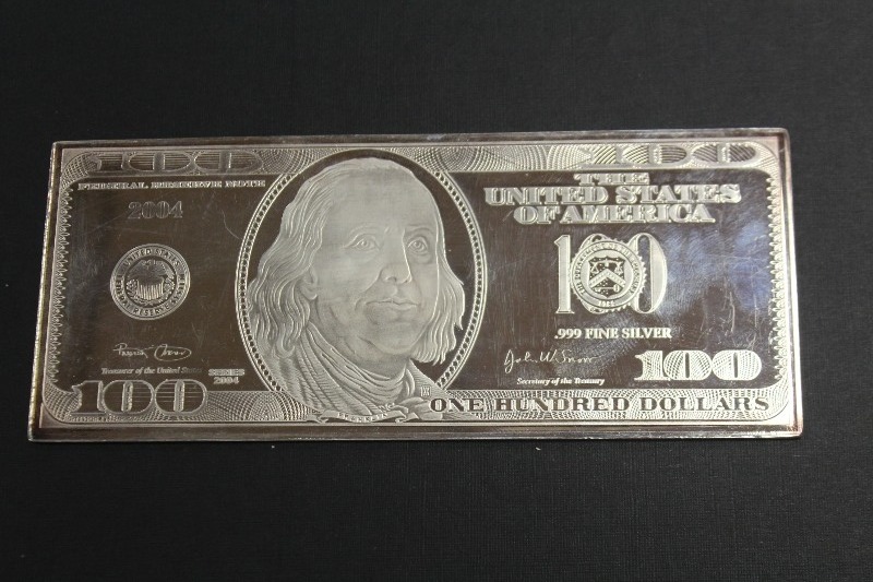 lot 4 image: 2004 Washington Mint Quarter Pound $100 Bill Silver Bar
