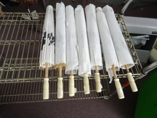 lot 24 image: 7 new bamboo umbrellas...