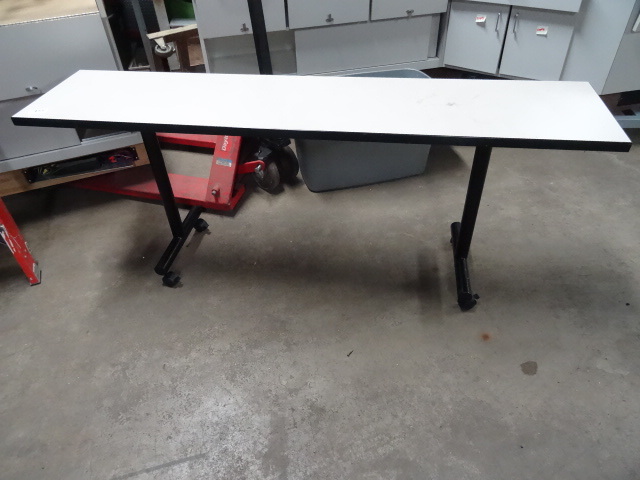 lot 155 image: Table on wheels. 72 x 16 x 29...