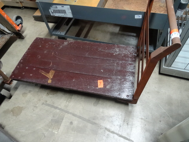lot 173 image: 4 wheel flat warehouse cart. 24 x 4...