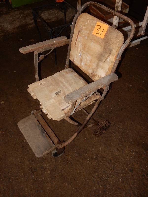 lot 31 image: Antique Wheel Chair.. Folds up